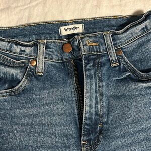 High waist medium/dark wash WRANGLER jeans.